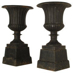 Pair of Neoclassical Style Cast Iron Urns on Plinth Bases