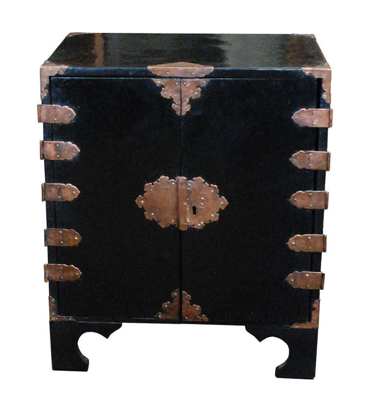 A Chinese mother-of-pearl inlaid chest with two long drawers over four short drawers and a locked door.