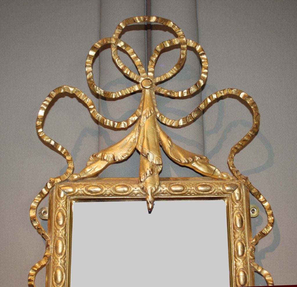 Pair of gold ribbon mirrors, fine pieces by English craftsman