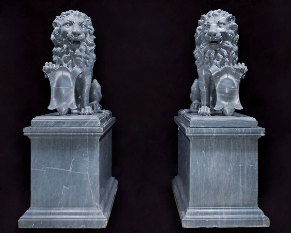 A pair of Italian carved marble lions on pedestals, formerly the property of a wealthy East Javanese sugar baron who purchased them while on holiday in Italy. They were then sold to a Chinese antique dealer in Malang, Java.

Lion: 20w x 29d x