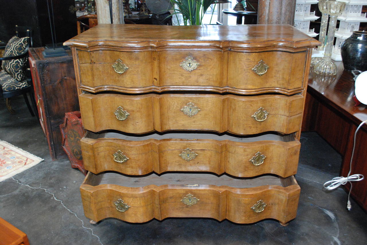 Serpentine Danish Oak Chest of Drawers 

Features four large drawers with original hardware.