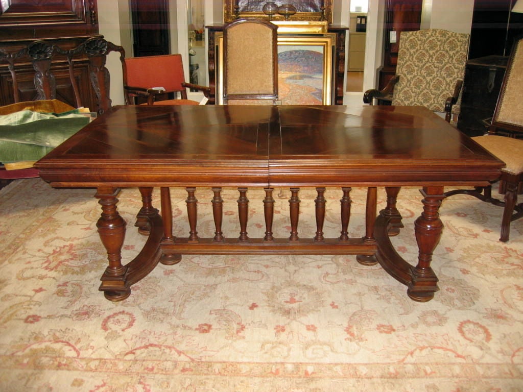 French spindle base dining table, spindles are stationary with table ends extending to accommodate twenty four people, found with two original 20” pine extensions. Additional extensions can be produced in pine, alder wood or walnut and finished to