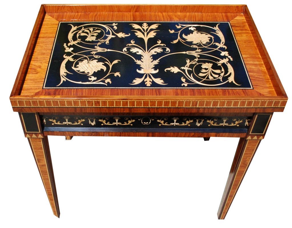 Superbly crafted Louis XVI “style” table with a removable tray top, sitting on four tapered legs. Inlaid with mahogany, zebrawood, rosewood and red oak.