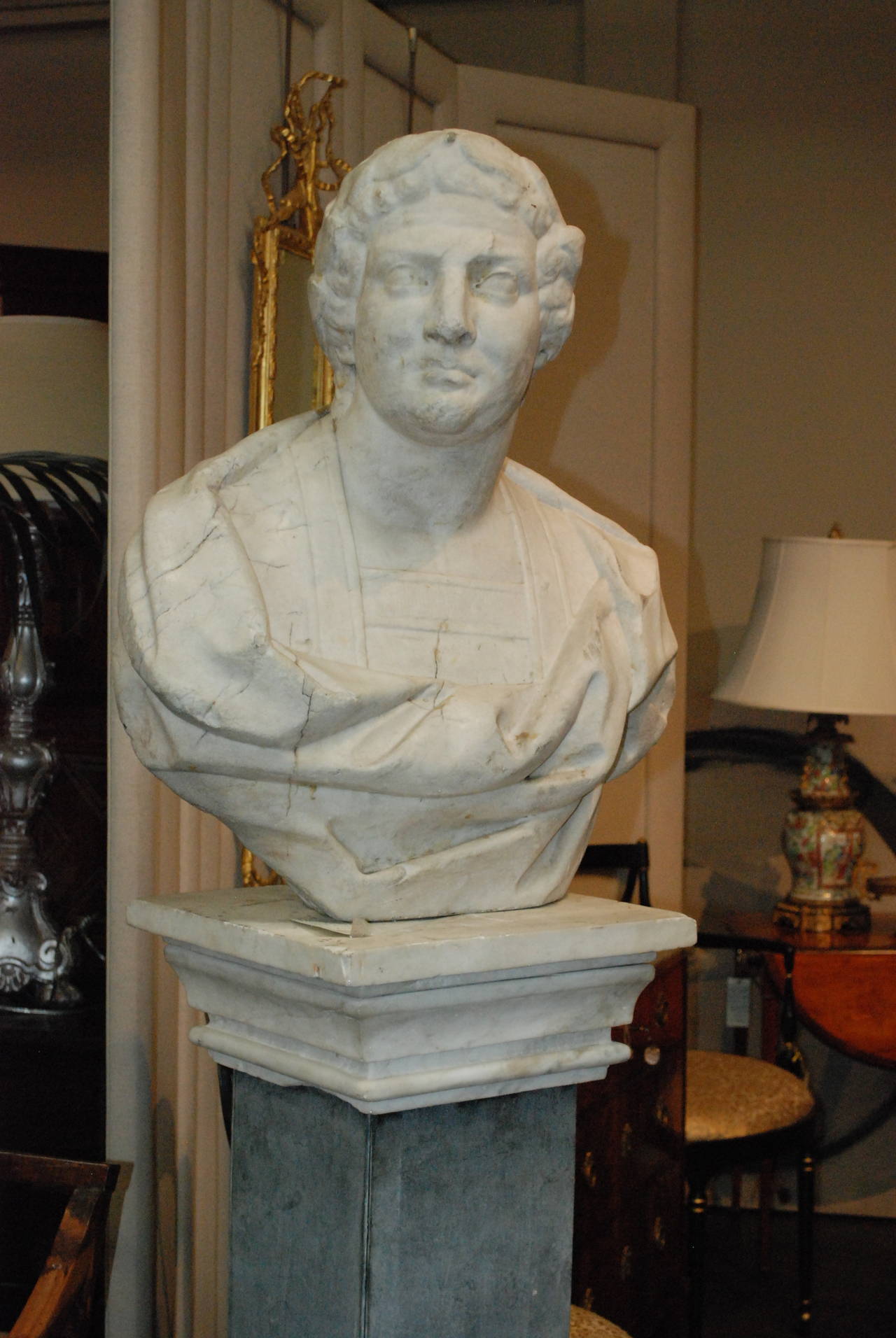 Italian antique marble bust on marble pedestal

minor chips and cracks.