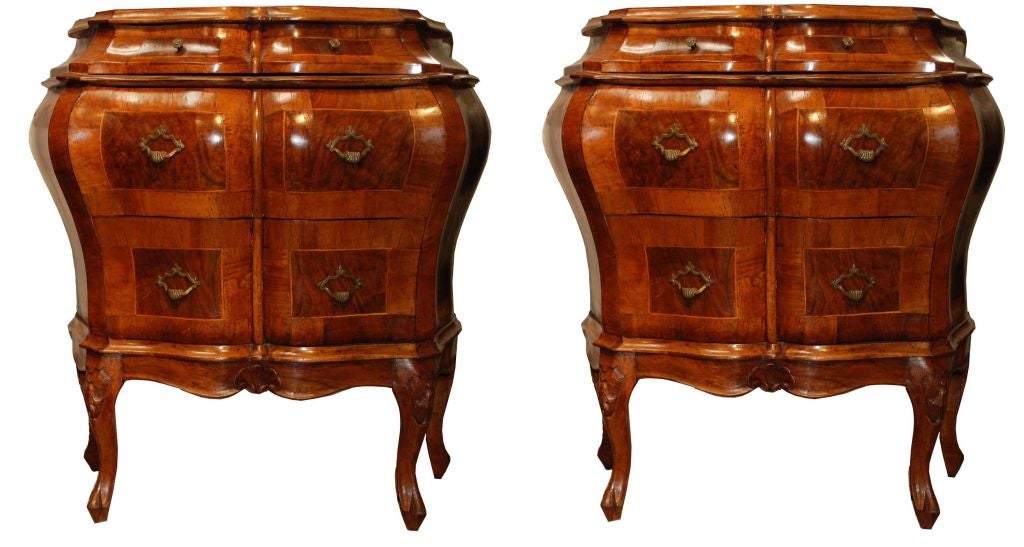 A pair of Italian Rococo style petite Bombay chests, each with four drawers.