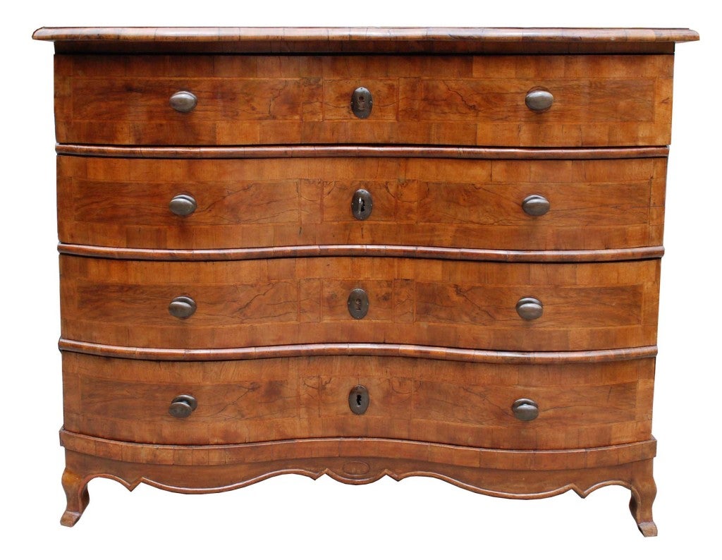 An English four-drawer chest with a serpentine front.