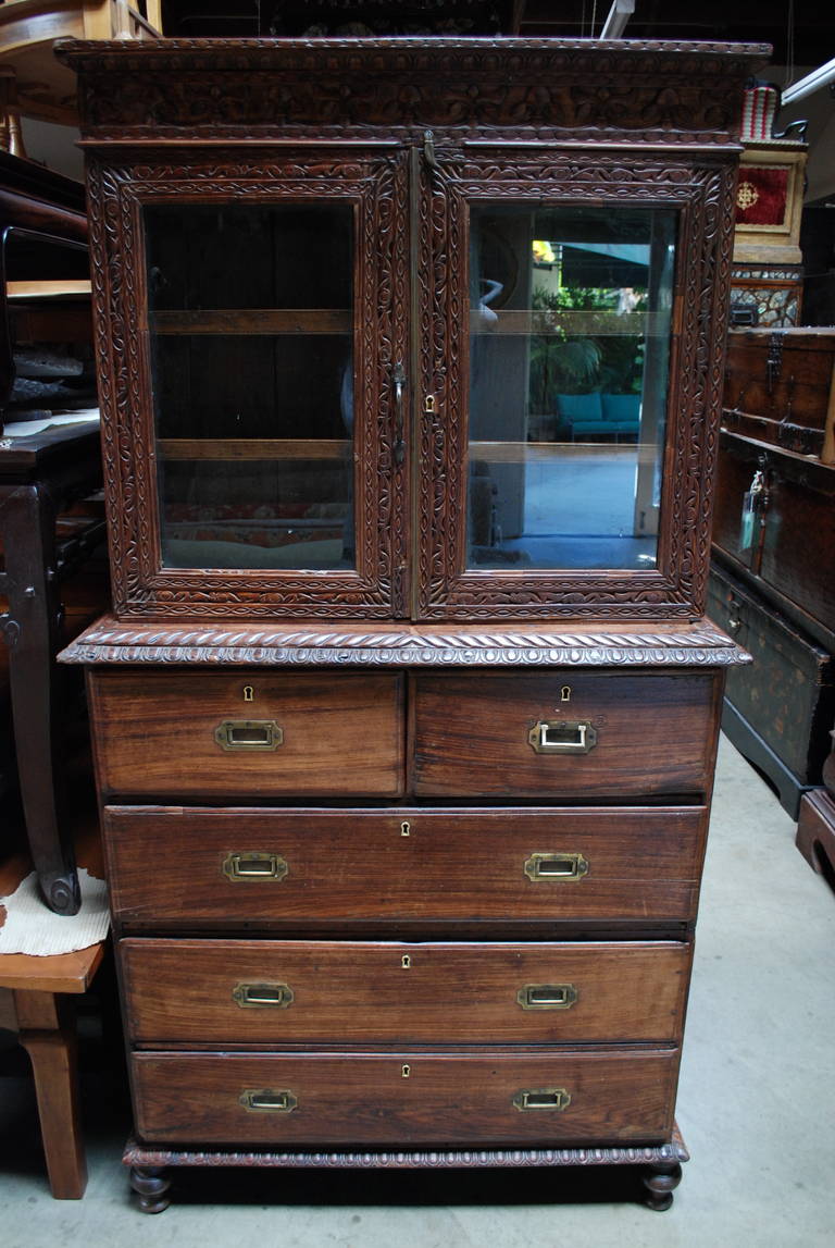 19th Century Goa Rosewood display cabinet with sunburst design on doors. Two small drawers with three large below. Keys included.