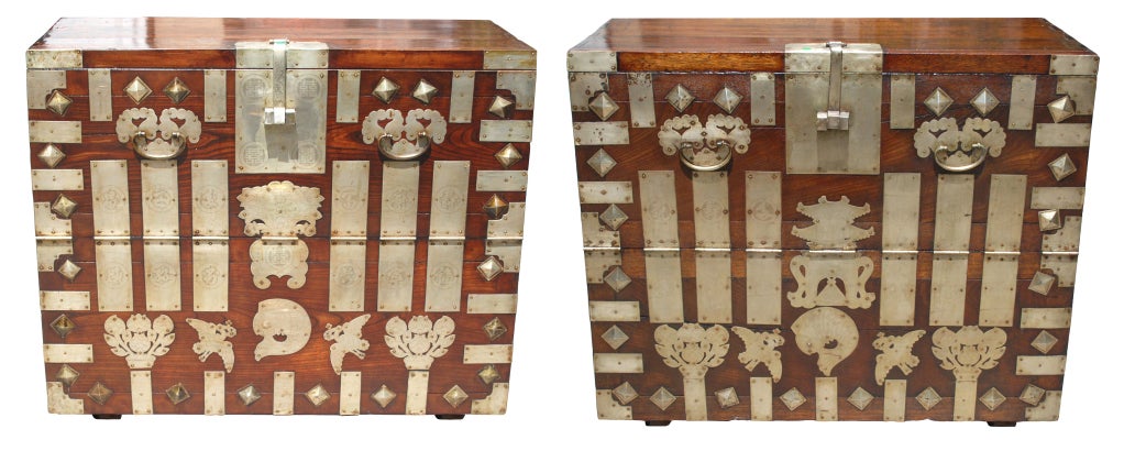 A complimentary pair of North Korean blanket chests (Bandaji) with etched German silver hardware and fish lock and key. The fish symbolizes perseverance and abundance. Opens from the front.

# PB2005: Chinese Northern Elm (Yumu) front with a cedar