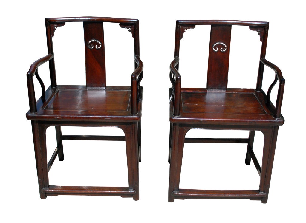 An irreplaceable pair of 18th Century, possibly earlier, walnut Ming “style” chairs with immortal mushrooms in the back splat.