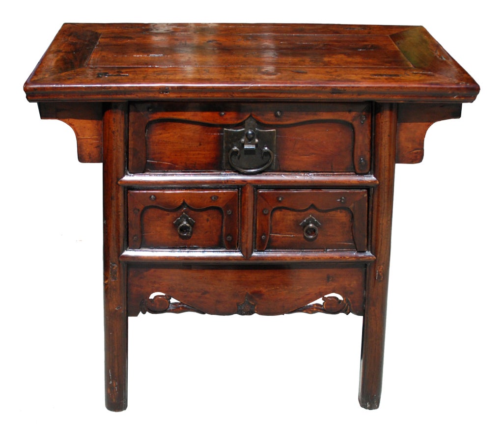 A rare Chinese carved chest with three drawers and a shaped lower panel. Made from slow growing ancient cedar (Baimu) from Northern China.