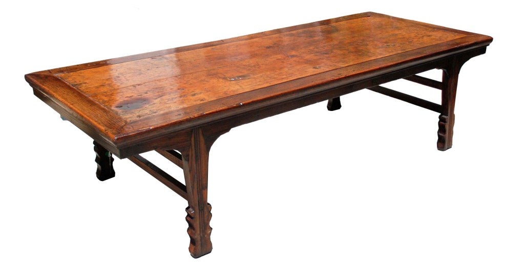A Chinese low Kang table, originally a day bed with Kangshi sword-shaped splayed legs popular during the reign of Kangshi 17th – 18th century.