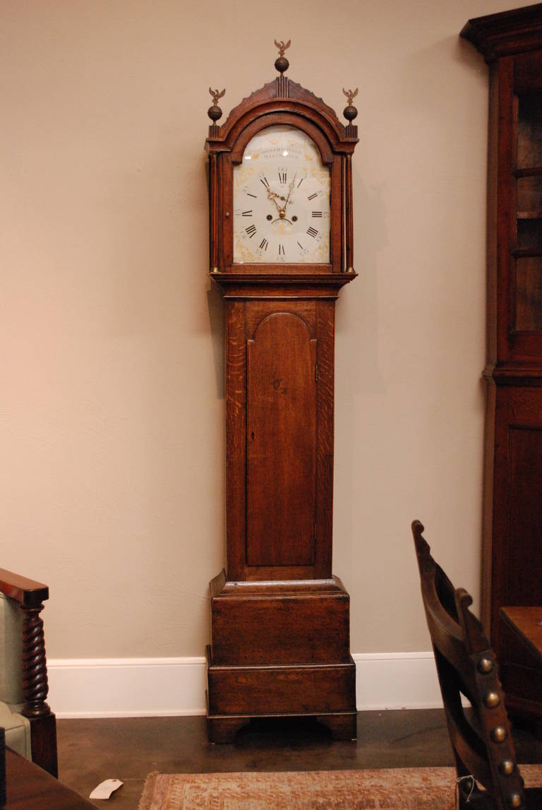 Early 19th Century English Winchester Clock by Joseph Fifield. Oak longcase with painted dial and three eagles, ball finials with keys