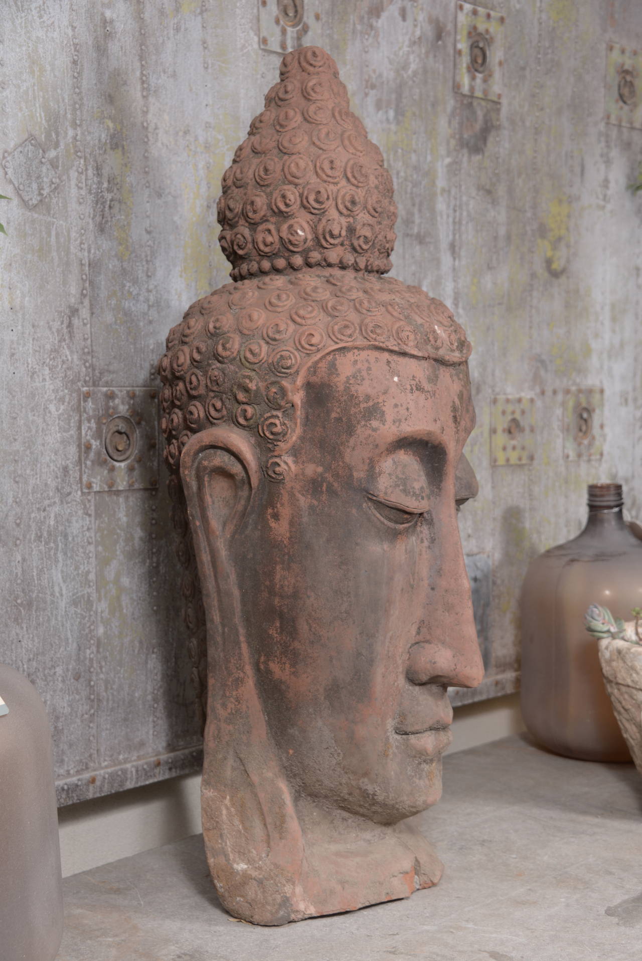 French terra cotta Buddha head sculpture from Paris, circa 1960, for indoor or outdoor use.