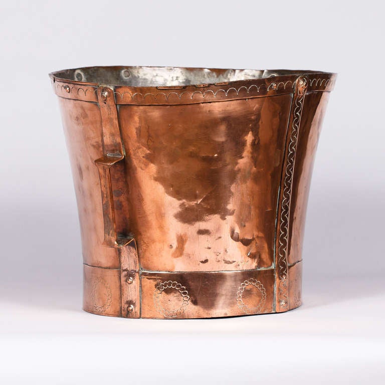 A 19th Century French Copper Water Measure with two handles called 
