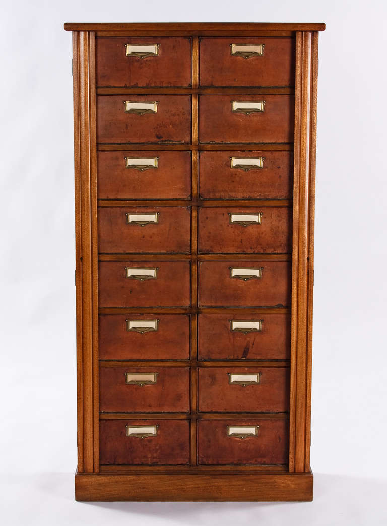A fine Louis Philippe Period Cartonnier made of mahogany. The Cabinet has 16 removable drawers made of leather and cardboard with brass pulls.