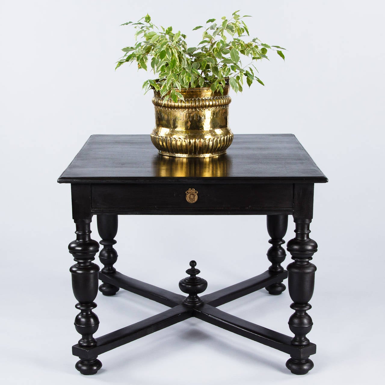 This Renaissance Style Table made of oak that has been painted black. The table features baluster legs, an X-shaped stretcher and bun feet. A great center table or game table! From floor to Apron: 25