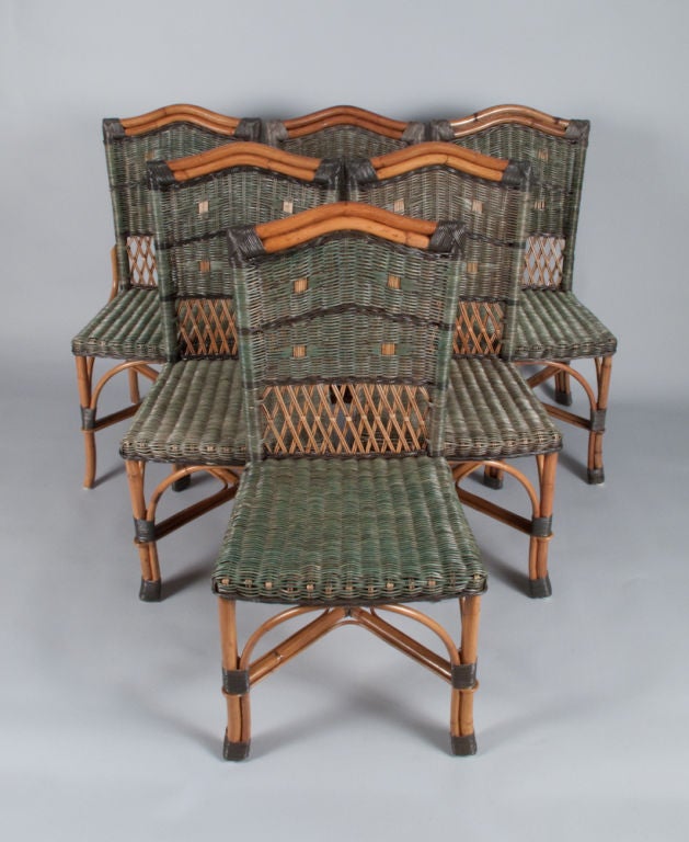 Since 1904, the Grange Company has created and manufactured French furniture.  This set of 6 Rattan Chairs from the 1970's are hand patinated and stained in green, blue and gray tones.<br />
<br />
Note: The 6 chairs are the same size but the