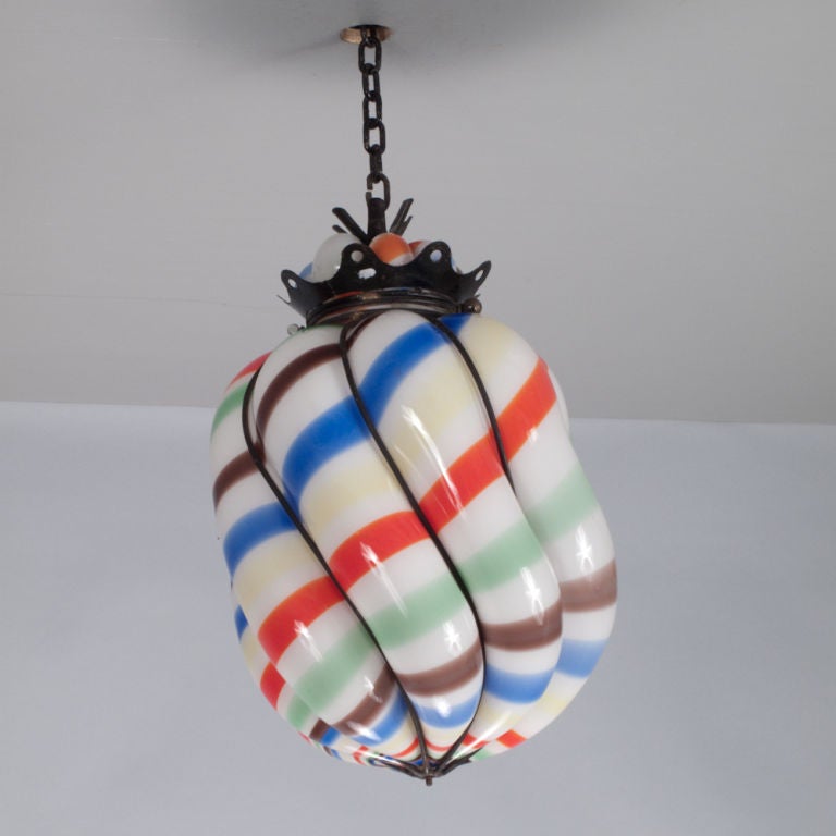 A colorful hand-blown Ceiling Light in Murano glass by the Italian master Gino Cenedese. Lantern has a forged iron structure.  The colors are vibrant and the shape whimsical!