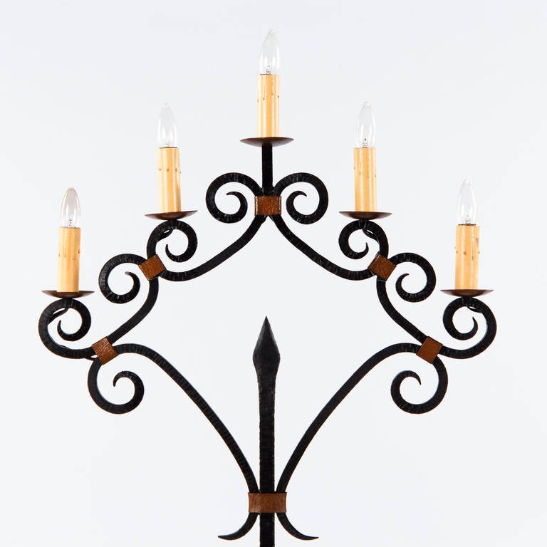 A 5 light Gothic Revival Floor Lamp in black forged iron with scroll motifs and copper accents.Each light bulb is medium base up to 60 watts.