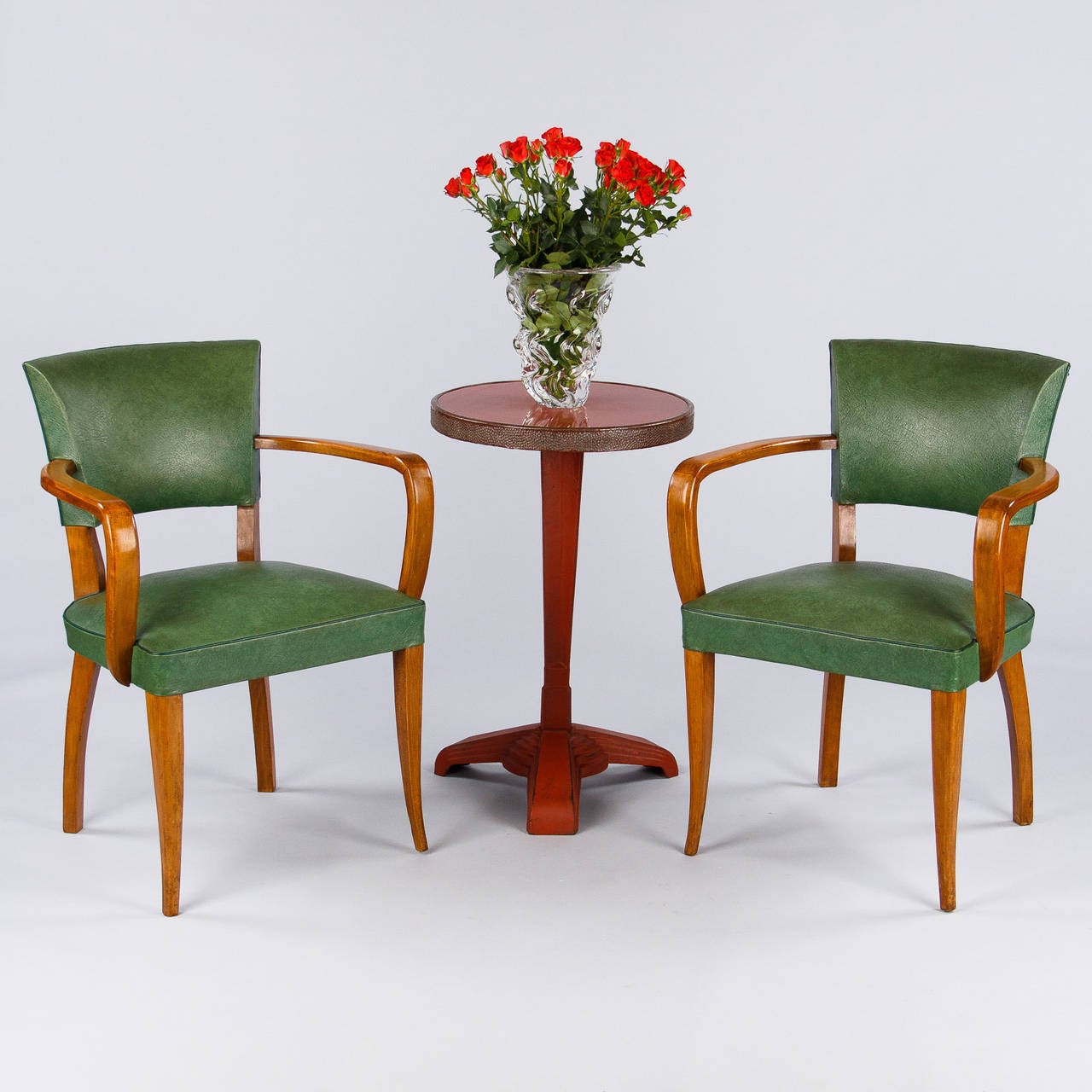 From Lyon, France, this set of four bridge armchairs date to the 1940s. Made of beech wood with curved armrests and legs, the seats and backs are light green vinyl with a darker green cording trim. Floor to seat: 17.50