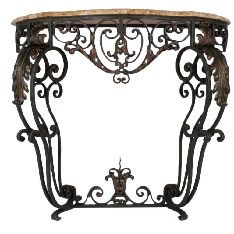 A stunning forged iron Console Table from Provence made in the Louis XV Style in the early 1900's. The iron base has a forest green patina with copper accents. The top is a beautiful cut and beveled Breche marble.