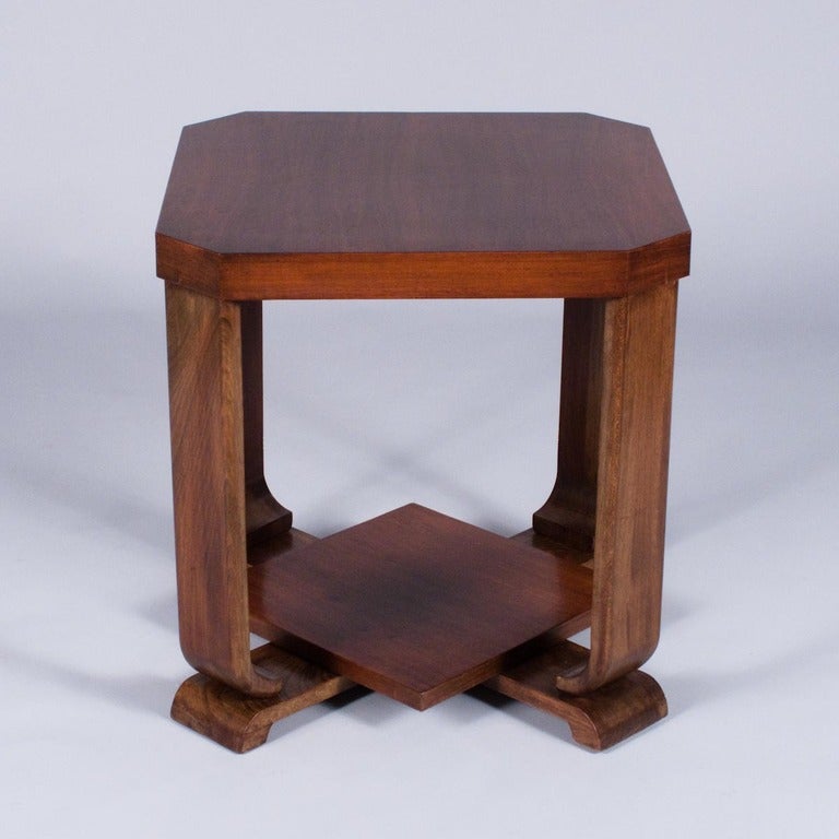 A 1930's Art Deco Side or Coffee Table in burl walnut veneer and curved walnut legs. The Table has a bottom shelf and the square top with cut edges has a small drawer in the apron.