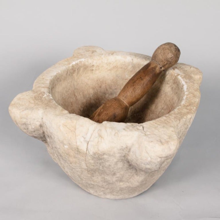 A beautiful antique Marble Mortar with a wooden pestle from the South of France.