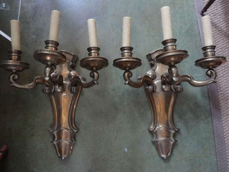 Monumental Pair French Louis XVI Style bronze sconces Maison Bagues Attributed.
Magnificent heavy pair of French Louis XVI brass sconces. This pair of fabulous well cast French 1940s bronze sconces have been newly wired for U.S. market. (Attributed