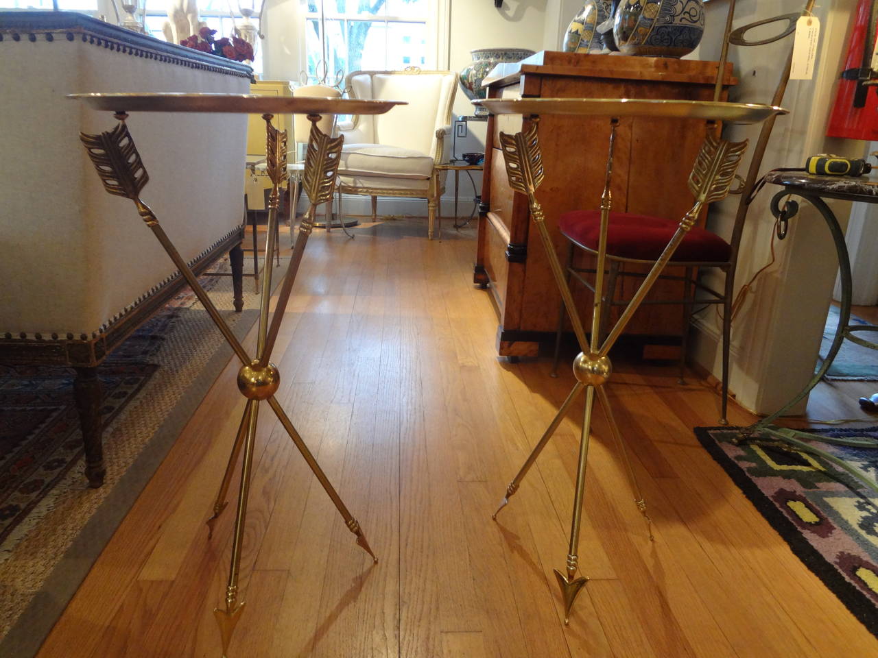 Matched pair of French Maison Jansen Directoire style bronze/brass arrow tray tables, circa. 1960.

 

    