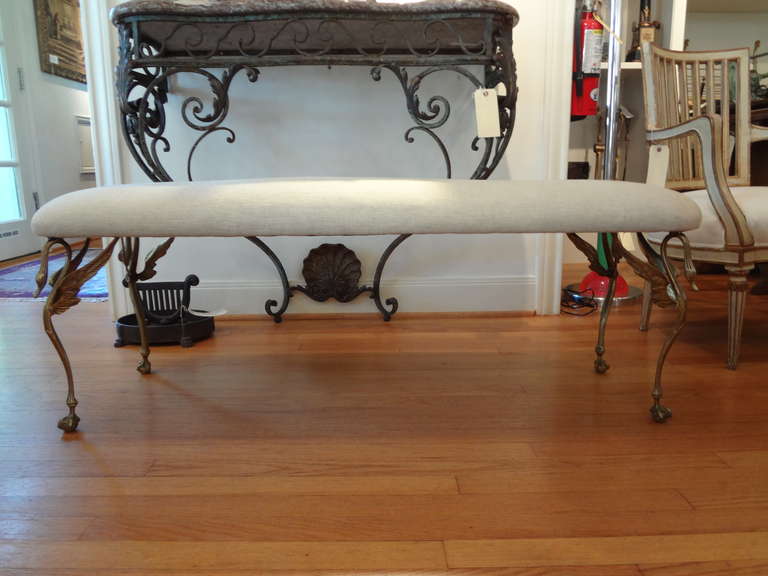 Stylish Italian Neoclassical modern brass swan bench newly upholstered in oatmeal linen.