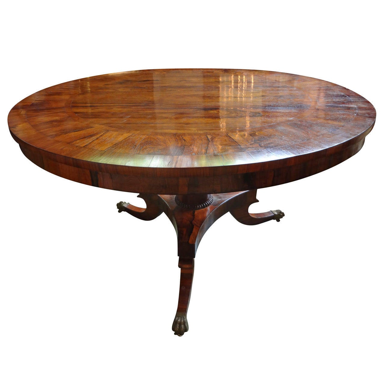 Early 19th century English Regency rosewood tilt-top center pedestal table or dining table with lovely banded detail and bronze mounts, circa 1830.

Please click KIRBY ANTIQUES logo below to view additional pieces from our vast inventory.

 