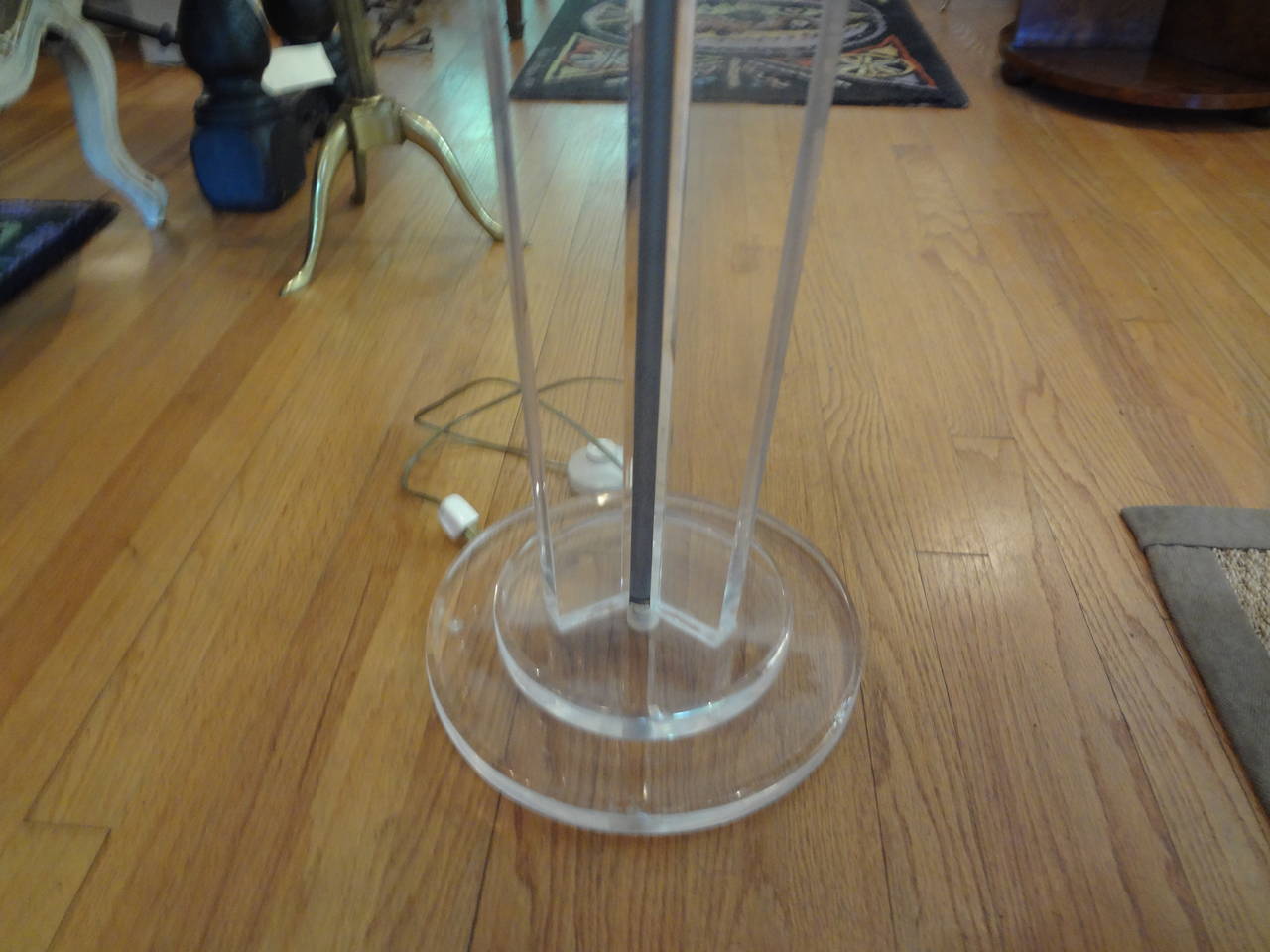 Mid-Century Modern lucite floor lamp or torchiere.
Neoclassical style acrylic floor torchère or floor lamp. This midcentury lucite floor lamp has a gunmetal grey sphere and shade.



