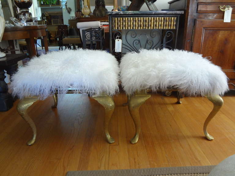 Chic pair of Hollywood Regency brass benches/stools, newly upholstered in Mongolian lambs wool.