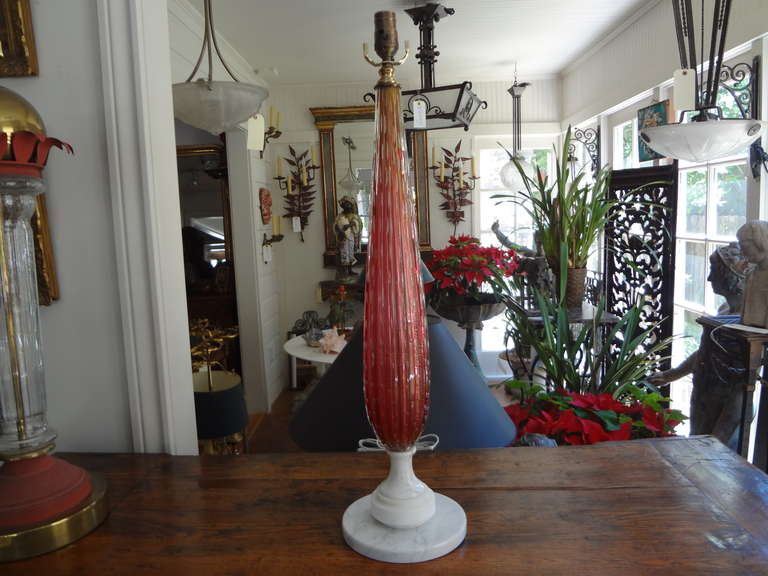 Gorgeous cranberry colored Murano glass lamp infused with gold flecks throughout on a marble base, newly wired for U.S. market.

   