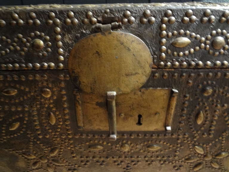 Handsome French leather clad coffer or trunk with brass stud trim from the 17th century. This beautiful antique blanket chest is displayed on a newer walnut stand. Fabulous!
 