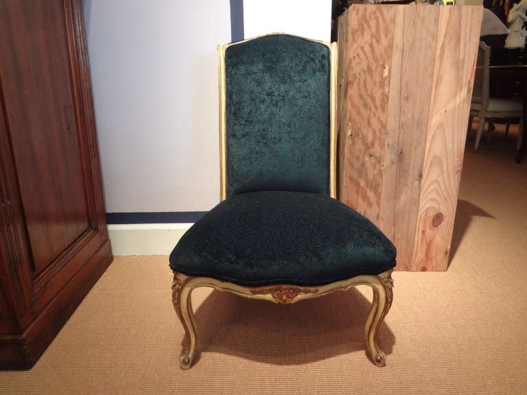 Antique French Louis XV style painted and giltwood chair.
Chic French Louis XV style painted and gilt wood side chair, slipper chair, chauffeuse or vanity chair, professionally upholstered in cut velvet. This stunning French lounge chair dates to