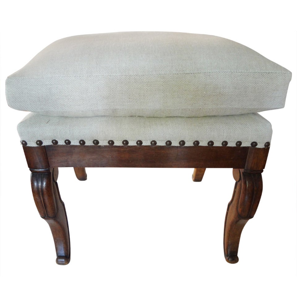 Handsome early 19th century French Charles X-walnut ottoman, bench or stool newly upholstered in oatmeal linen with a semi-loose cushion and nailhead trim.



 