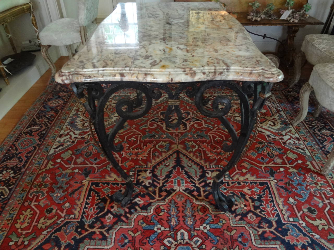 Gilbert Poillerat inspired French wrought iron center table.
Beautifully hand forged antique French rectangular wrought iron console table or centre table with gilt iron accents retaining original marble top in the manner of Gilbert Poillerat. Jean