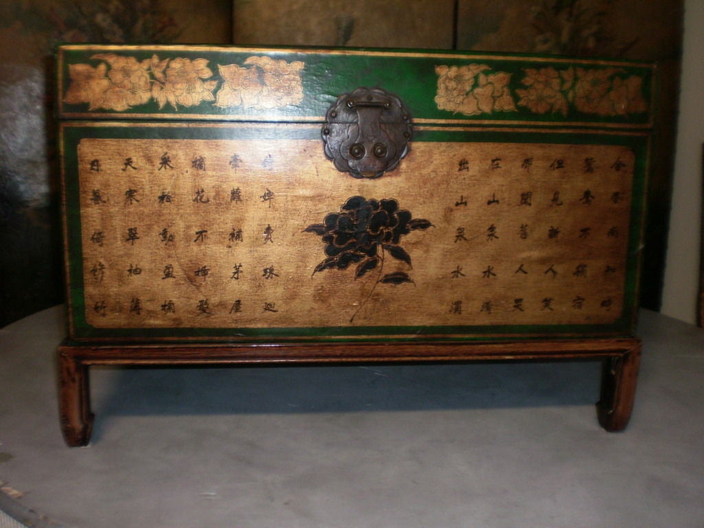 Hand decorated Chinese green and gold leather trunk with Chinese characters on newer rosewood stand. This great chinoiserie style trunk would make a great cocktail table.



  