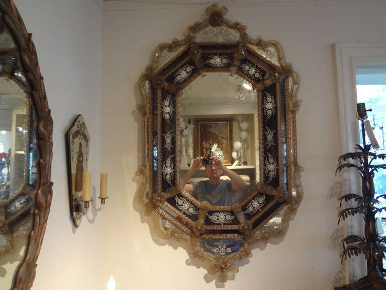 An octagonal Murano glass mirror with etched floral design in great condition.
 