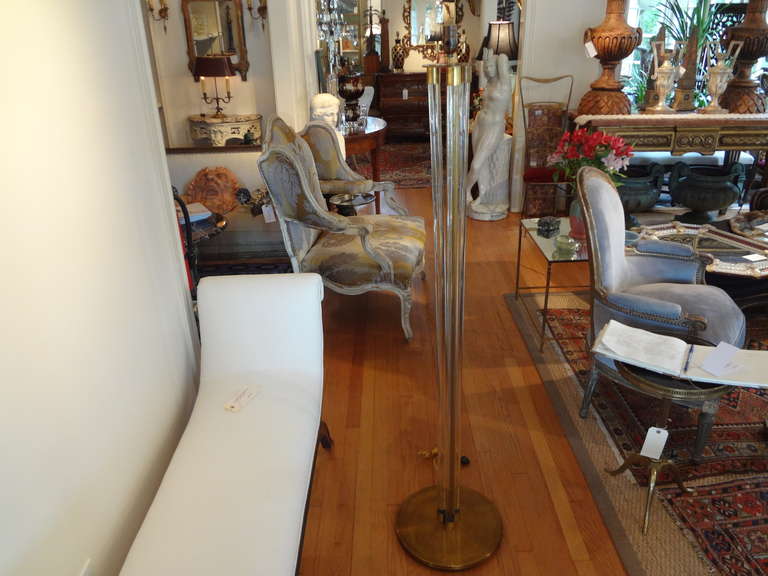 Italian Murano glass and bronze floor lamp.
Chic Italian Fontana Arte style modernist floor lamp of bronze with glass tubes, newly wired for U.S. market. We have seen a similar floor lamp or torchère attributed to Jacques Adnet.

