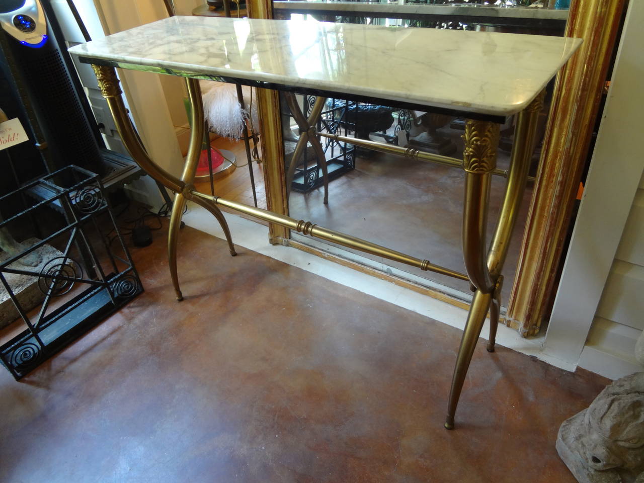 Stylish and versatile Italian Mid-Century Neoclassical style curule brass free standing  console or sofa table with original marble top inspired by Gio Ponti. Use as a console table, sofa table or side table.

 