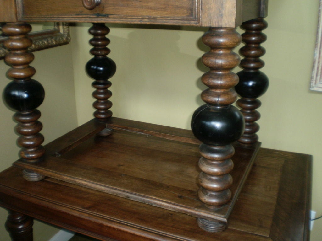 Handsome 19th Century French Louis XIII style walnut table with turned legs and a single drawer on bun feet. Rustic work or farm table.

      