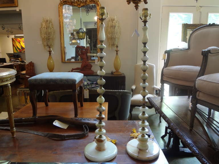 Stylish Pair Of Tall Italian Onyx Table Lamps, Newly Wired For U.S. Market.

Please click KIRBY ANTIQUES logo below to view additional pieces from our vast inventory.