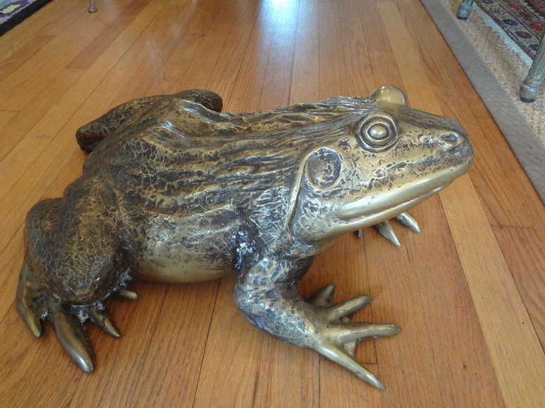 Extremely realistic detailing in this Hollywood Regency patinated brass frog statue.

Please click KIRBY ANTIQUES logo below to view additional pieces from our vast inventory.