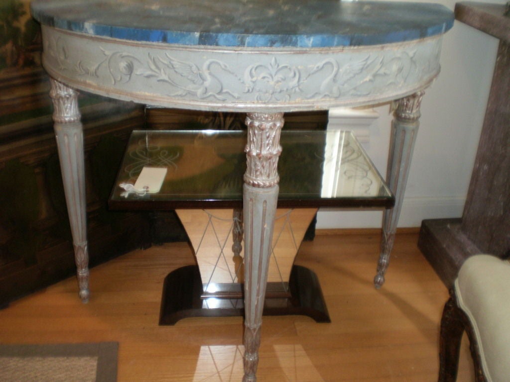 Lovely freestanding 19th century neoclassical style Italian hand painted and silver gilt console table, demilune or sofa table with faux marble top. This stunning Italian painted and silver leaf console table is versatile enough to work in a variety
