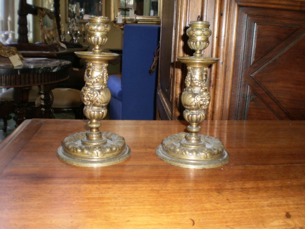 Beautifully detailed rare pair of French Louis XIV bronze candleholders or candlesticks from the 18th century.
Beautiful patina to bronze.

