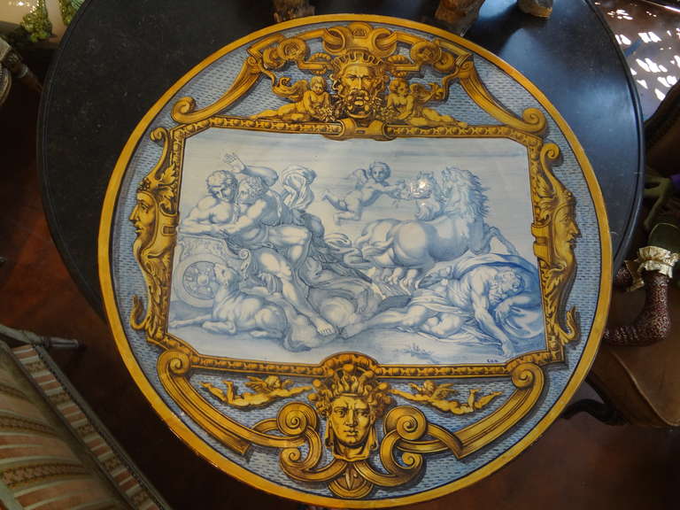 Stunning 19th century hand decorated French Majolica charger signed E.H.M. This antique tin glazed ceramic or faience charger is in the manner of Urbino. Measures: 25”. This beautiful French charger would look great on a stand or displayed as wall