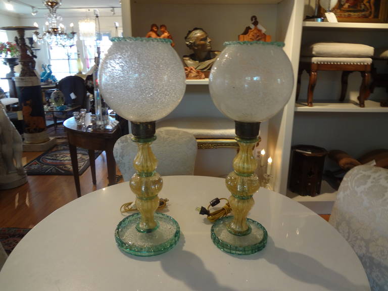 Pair of Murano glass lamps attributed to Seguso.
Unusual pair of Murano glass lamps from the 1940s (one slightly taller with slightly larger base, they are individually hand blown) not noticeable when separated.
These Italian midcentury Murano lamps