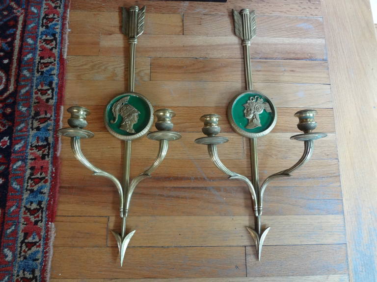 Well chased pair of French Neoclassical Maison Jansen Style, two-light brass sconces with arrow and center medallion figures.
These sconces have not been wired, but can be if desired.

Please click on 'KIRBY ANTIQUES